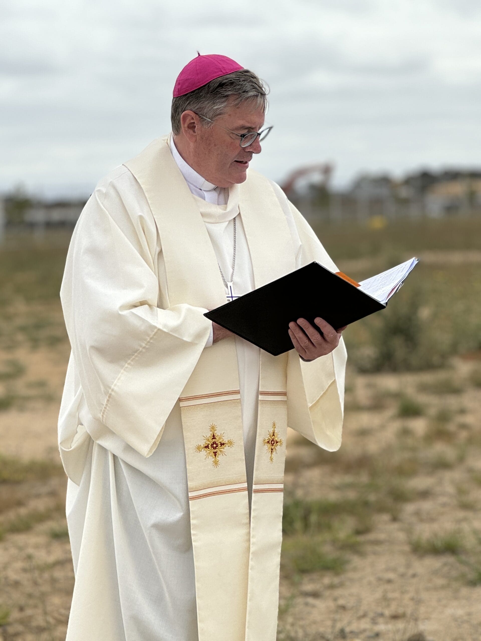 Bishop Greg Bennet at turning of sod at new school at Drouin. rouon 